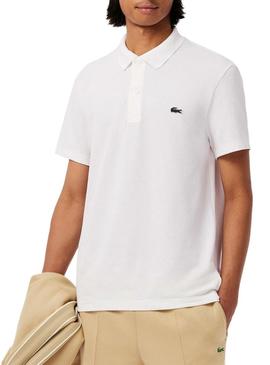 Camisa polo Lacoste branca com detalhes nas bordas para homem.