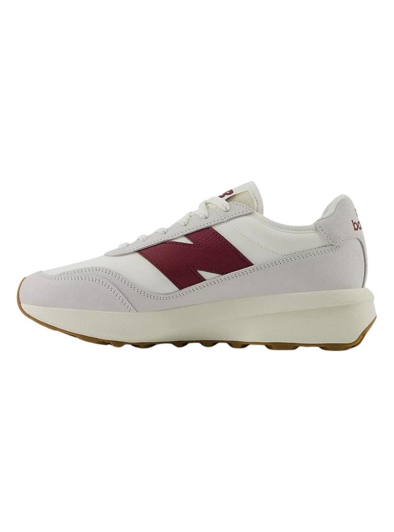 Sapatilhas New Balance U370 branco e grená para mulher e homem.
