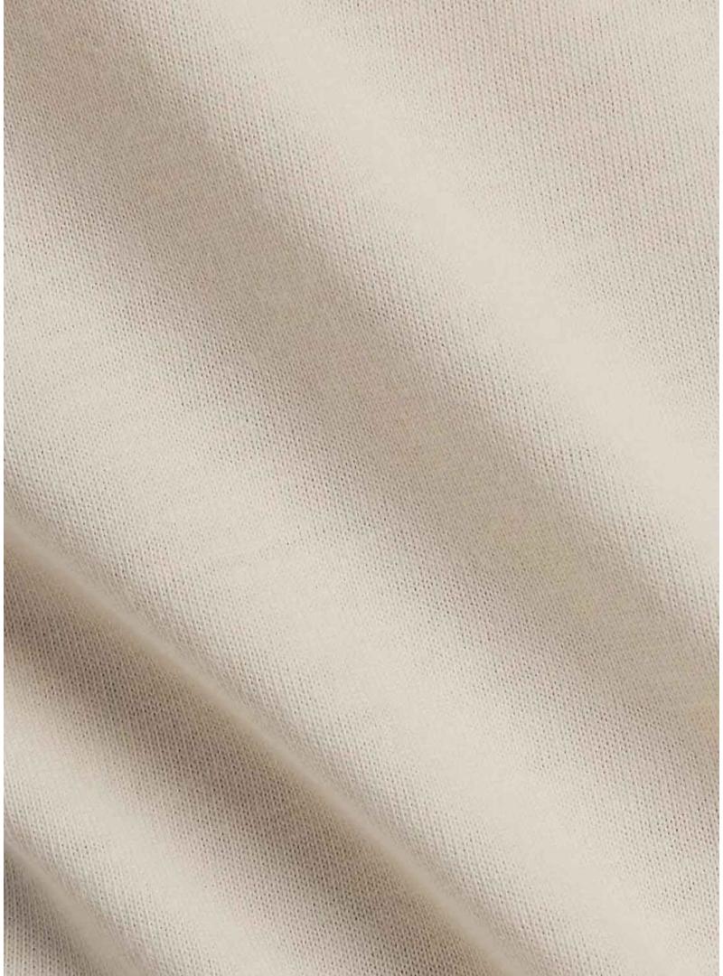 Camiseta New Balance Reimaginada bege para mulher.