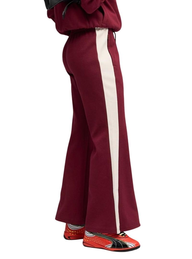 Calça esportiva Puma acampanada granate T7 para mulher.