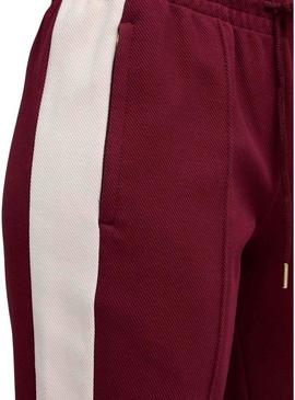 Calça esportiva Puma acampanada granate T7 para mulher.